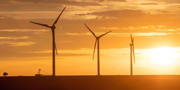 Wind turbines at sunset